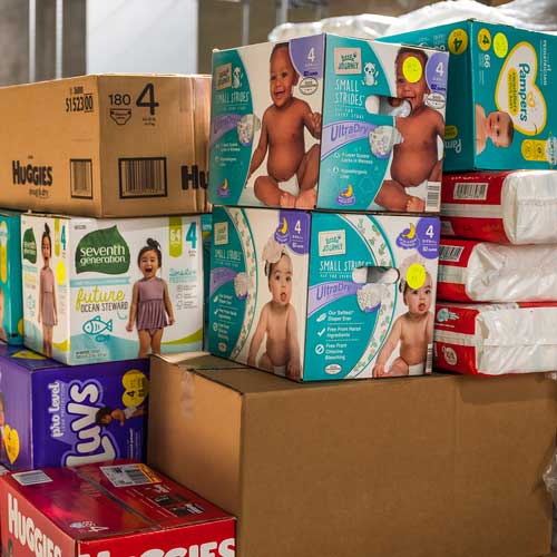 Supporters of Share Our Spare give diapers